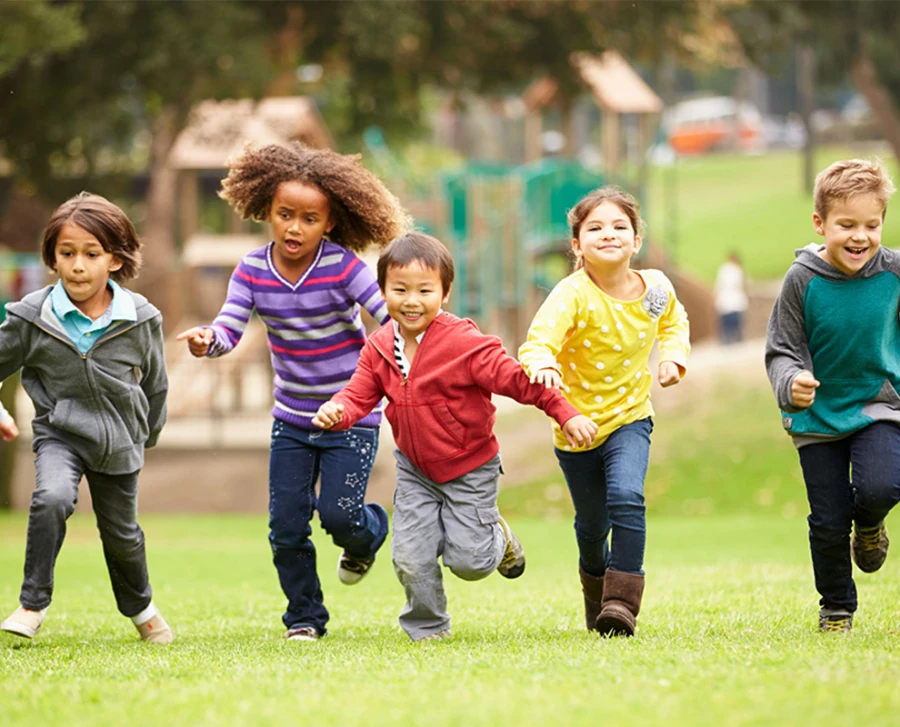 Group of children running in a park