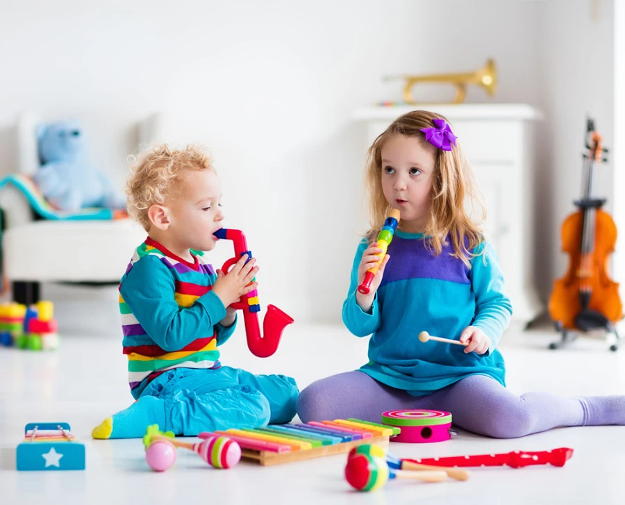 Kids playing with toy musical instruments
